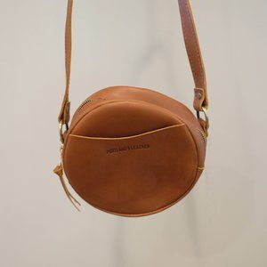 Portland Leather “Almost Perfect” Circle Crossbody, brand new. Size Small.